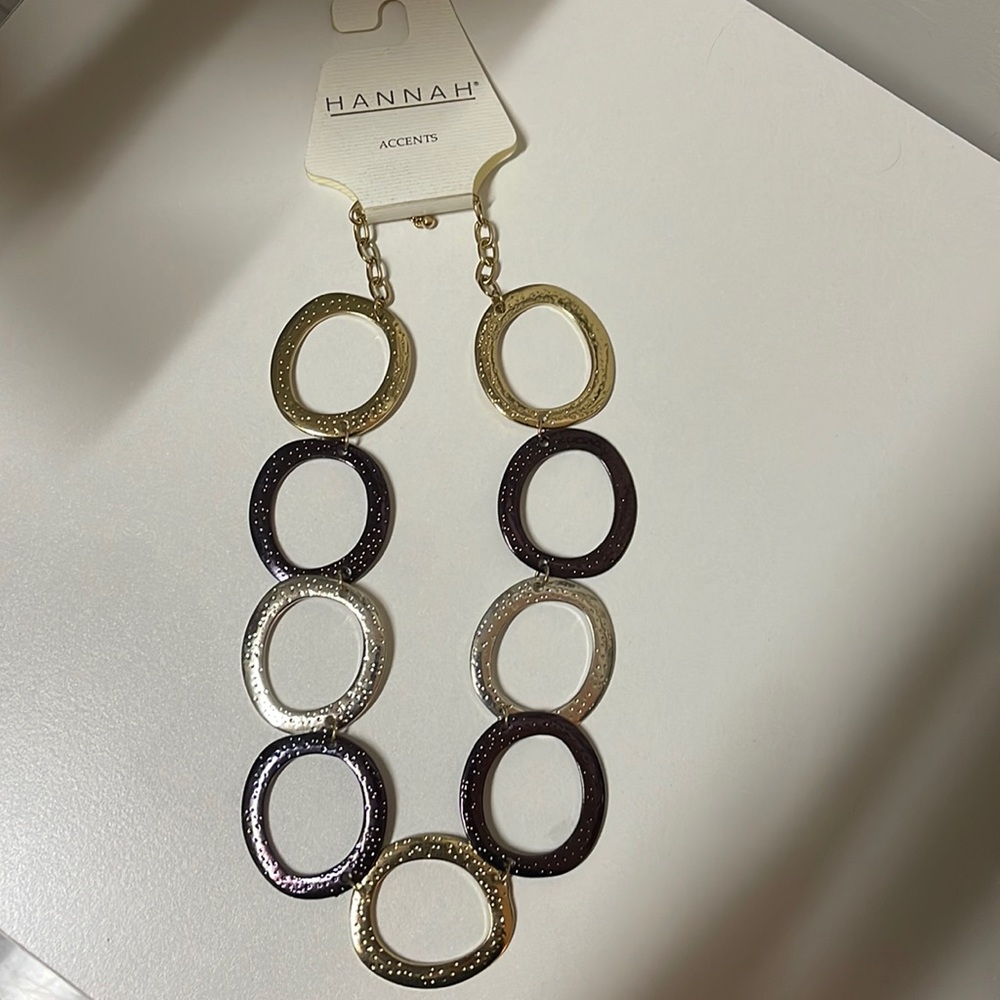 Brand new, with tags necklace. Multi-colored metals.